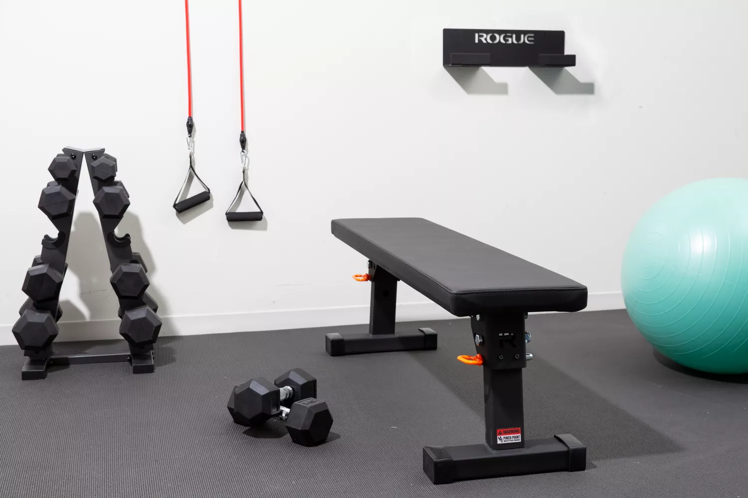 Rogue Fold-Up Utility Bench set up in small gym