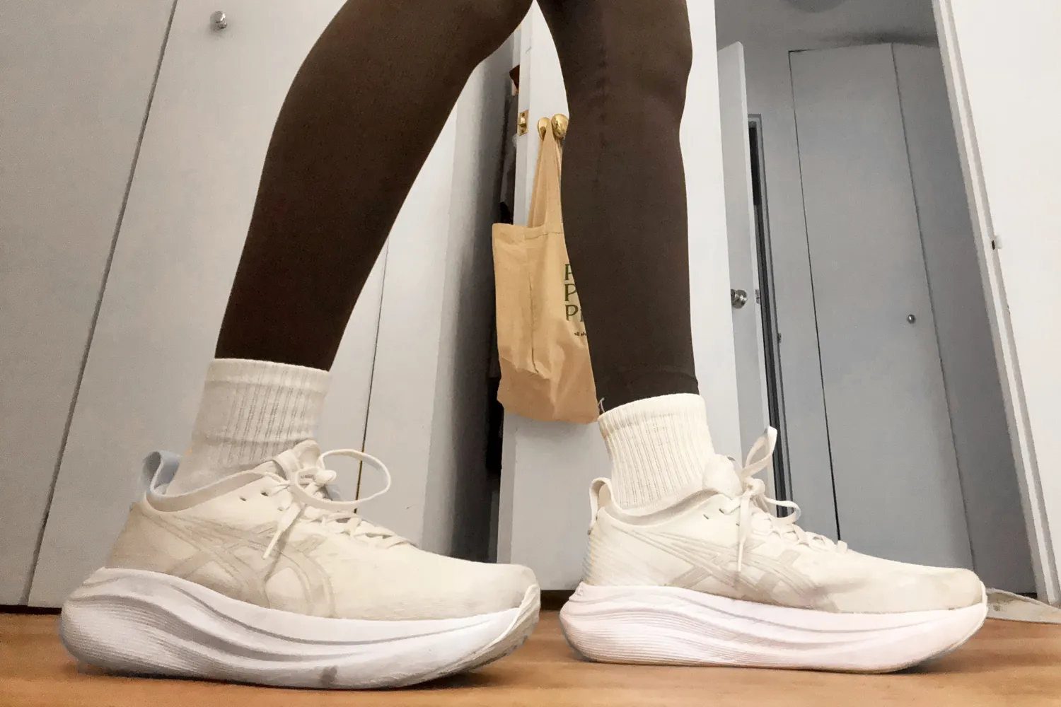 a person wearing Asics Gel Nimbus 27 shoes