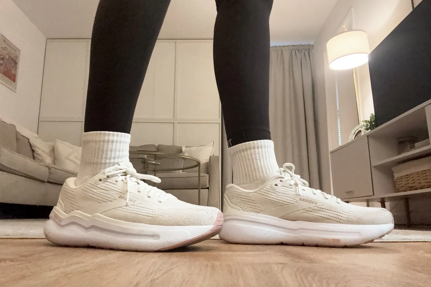 Person wearing Brooks Ghost Max 2 Shoes in a living room