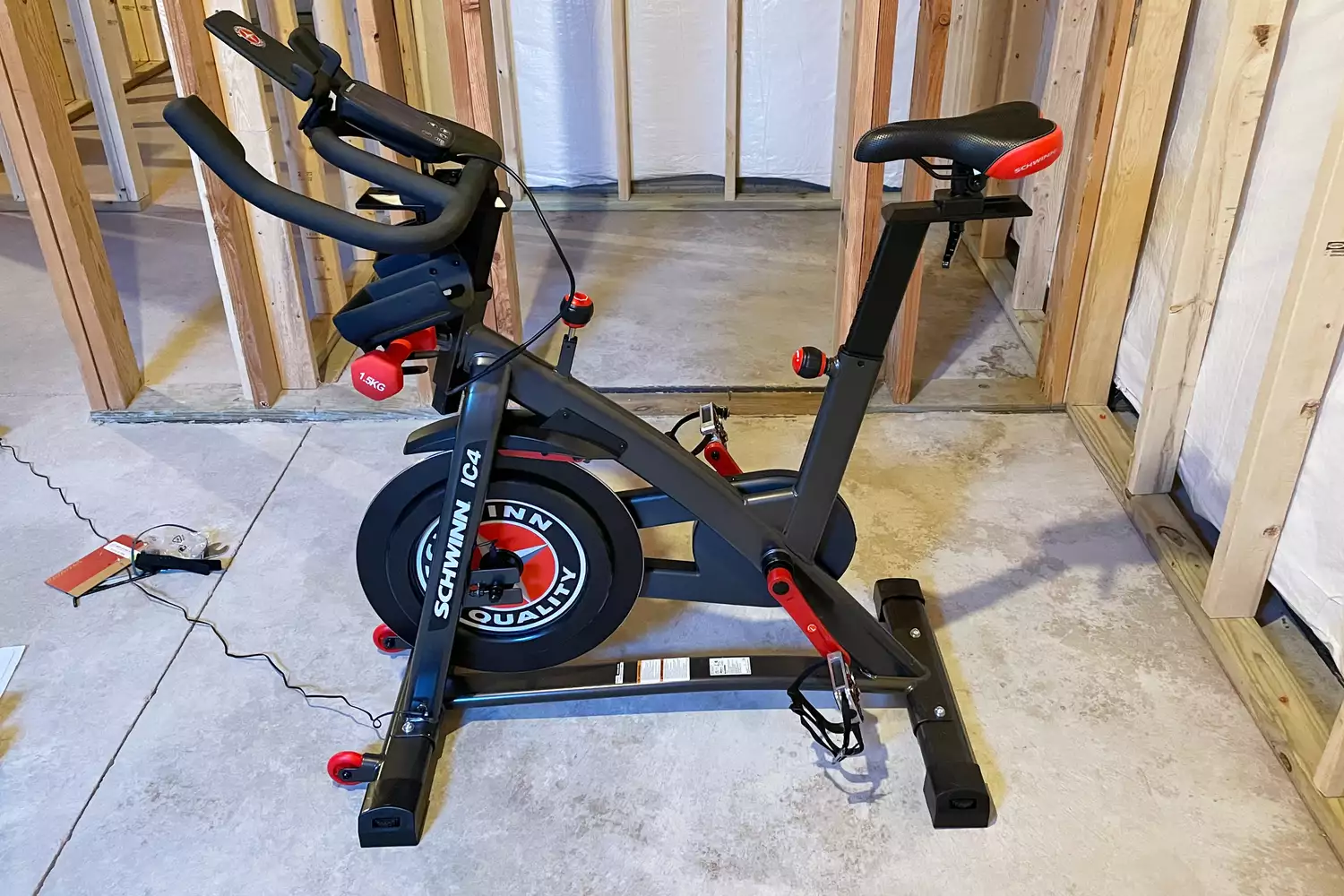 Schwinn IC4 Indoor Cycling Bike in an unfinished basement 